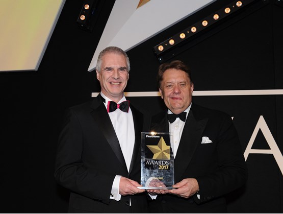 Hyundai national fleet sales manager Paul Williams (left) was presented with the award by transport minister John Hayes CBE